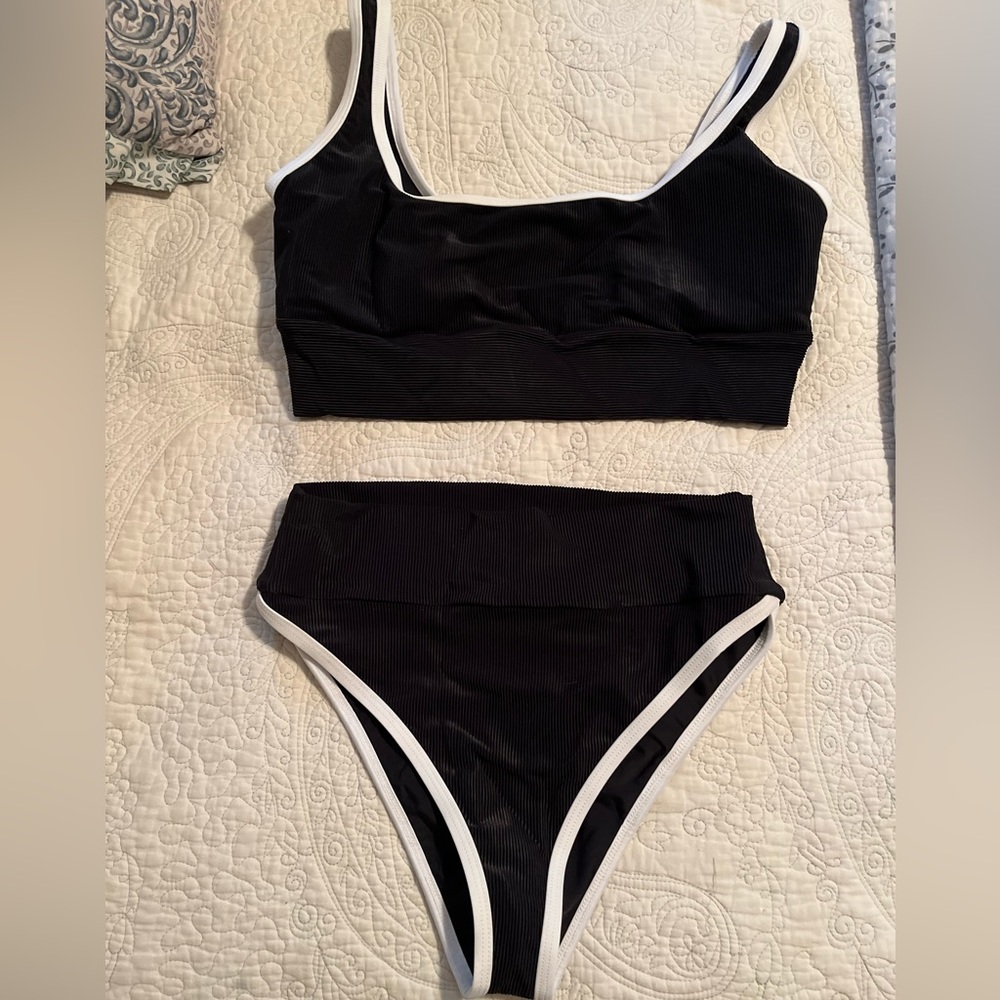 Lain Snow Two piece Bikini. Black with white trim. Large Top and Medium bottom.